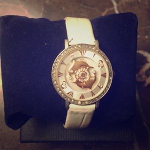 White spinning dolphin watch